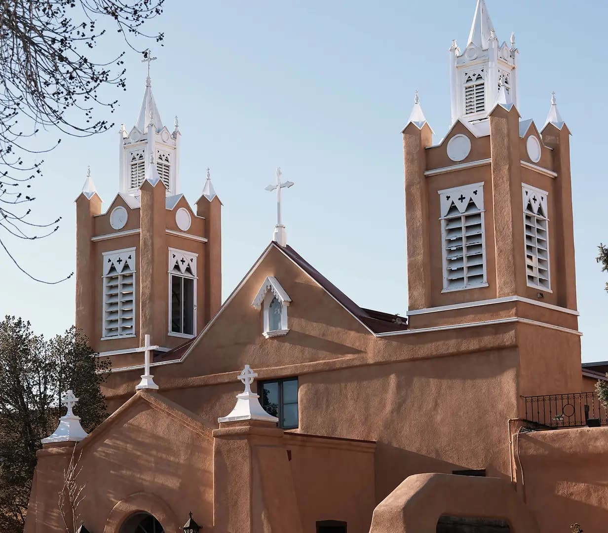 Twin adobe towers of San Felipe de Neri Church in Old Town Albuquerque, New Mexico, a charter bus tour stop