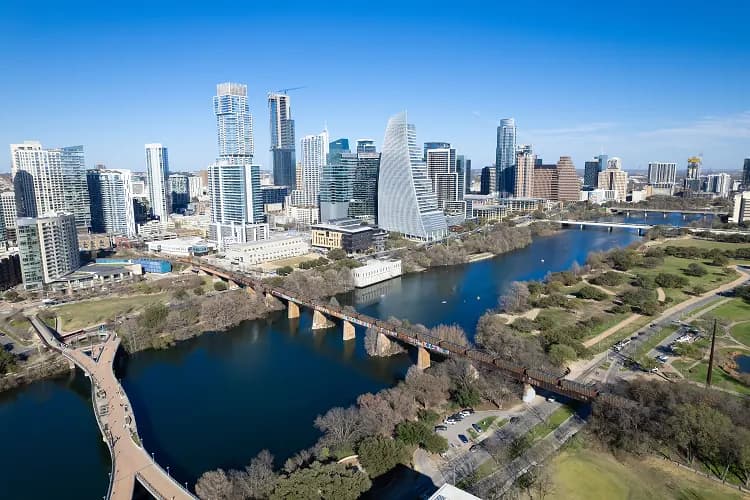 Aerial view of the Austin, Texas skyline and the bridges over Lady Bird Lake, the routes charter bus groups ride downtown
