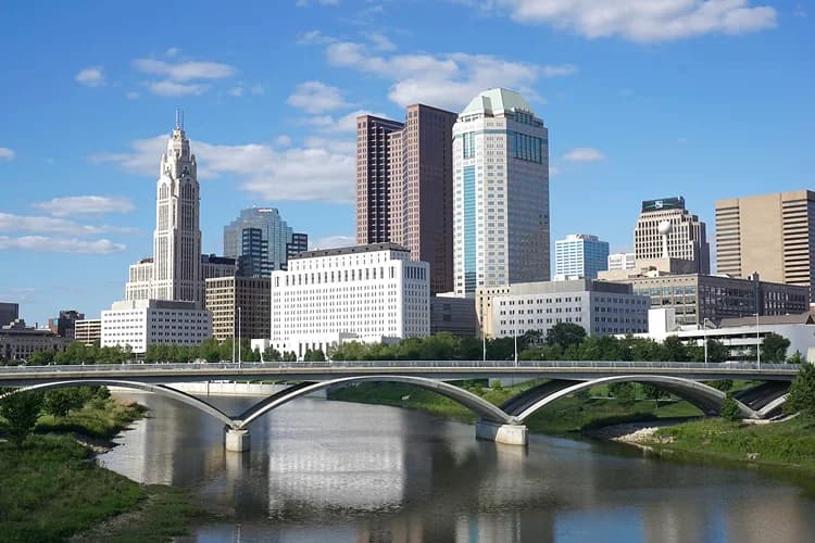 Downtown Columbus, Ohio skyline with the LeVeque Tower across the Scioto River, a common pickup area for charter bus groups