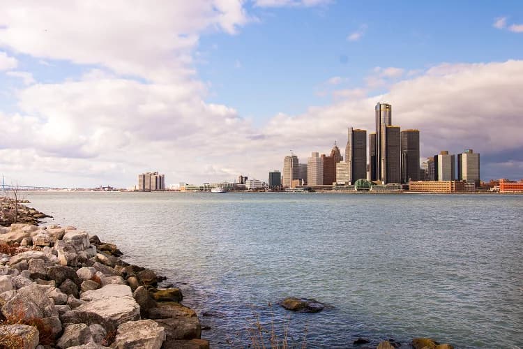 The Detroit skyline along the riverfront, anchored by the cylindrical towers of the Renaissance Center