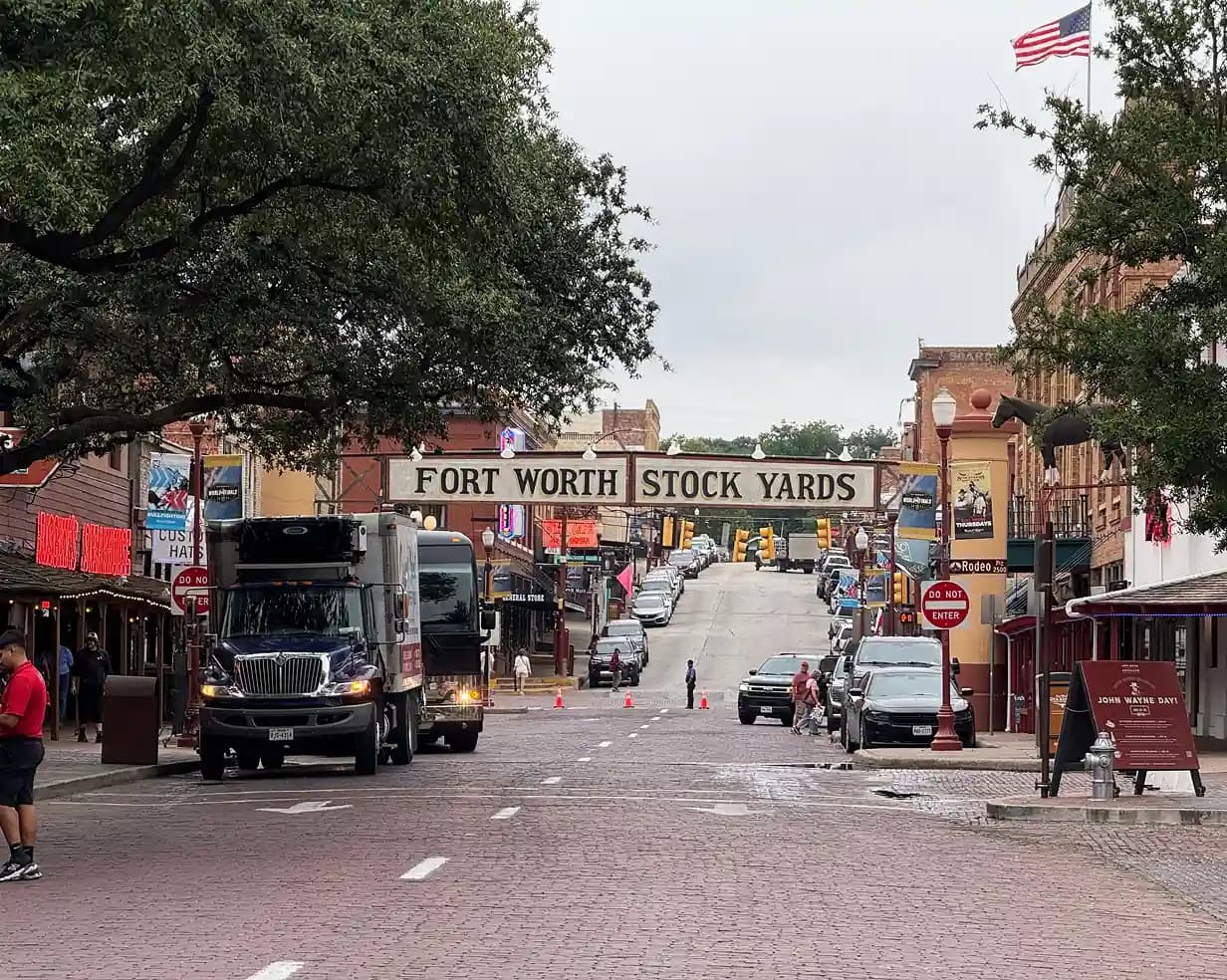 Brick street in the historic Fort Worth Stockyards district, a charter bus Stockyards-nights destination
