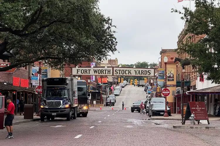 Brick street in the historic Fort Worth Stockyards district, a charter bus Stockyards-nights destination