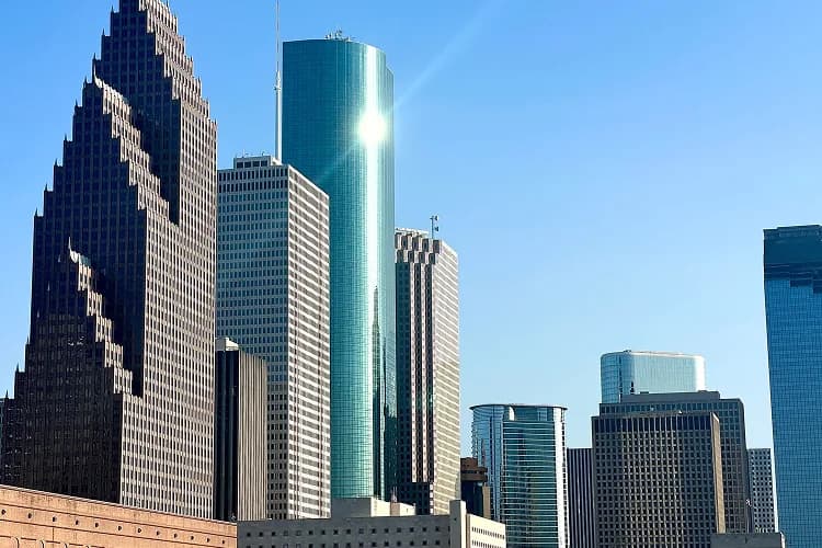 Sun reflecting off the glass skyscrapers of downtown Houston, Texas, a common pickup area for charter bus groups