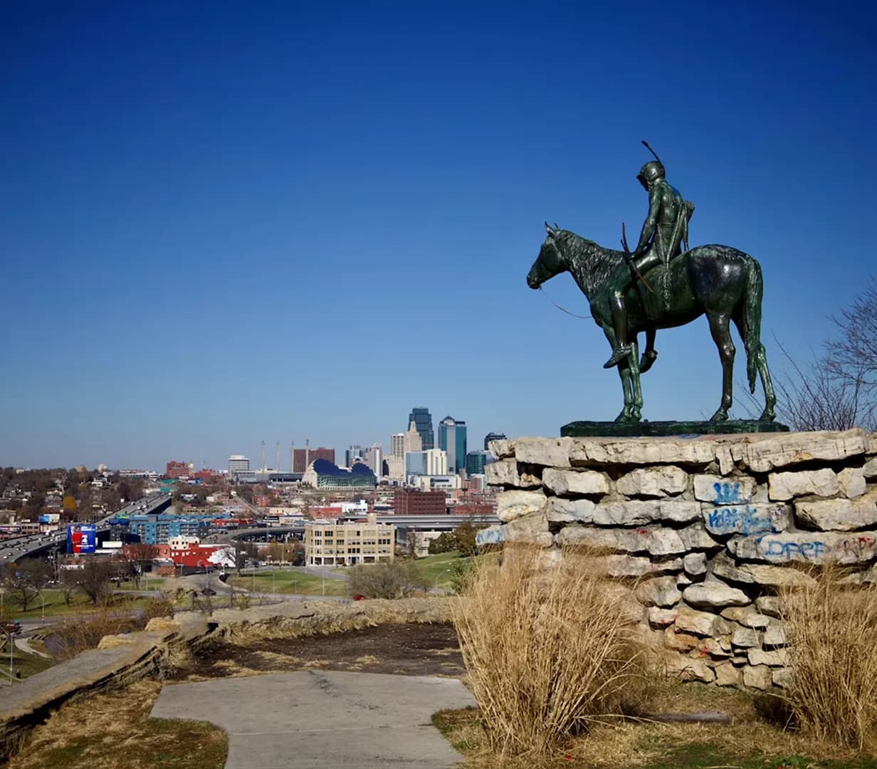 The Scout statue on horseback overlooking the Kansas City, Missouri skyline, a charter bus tour viewpoint