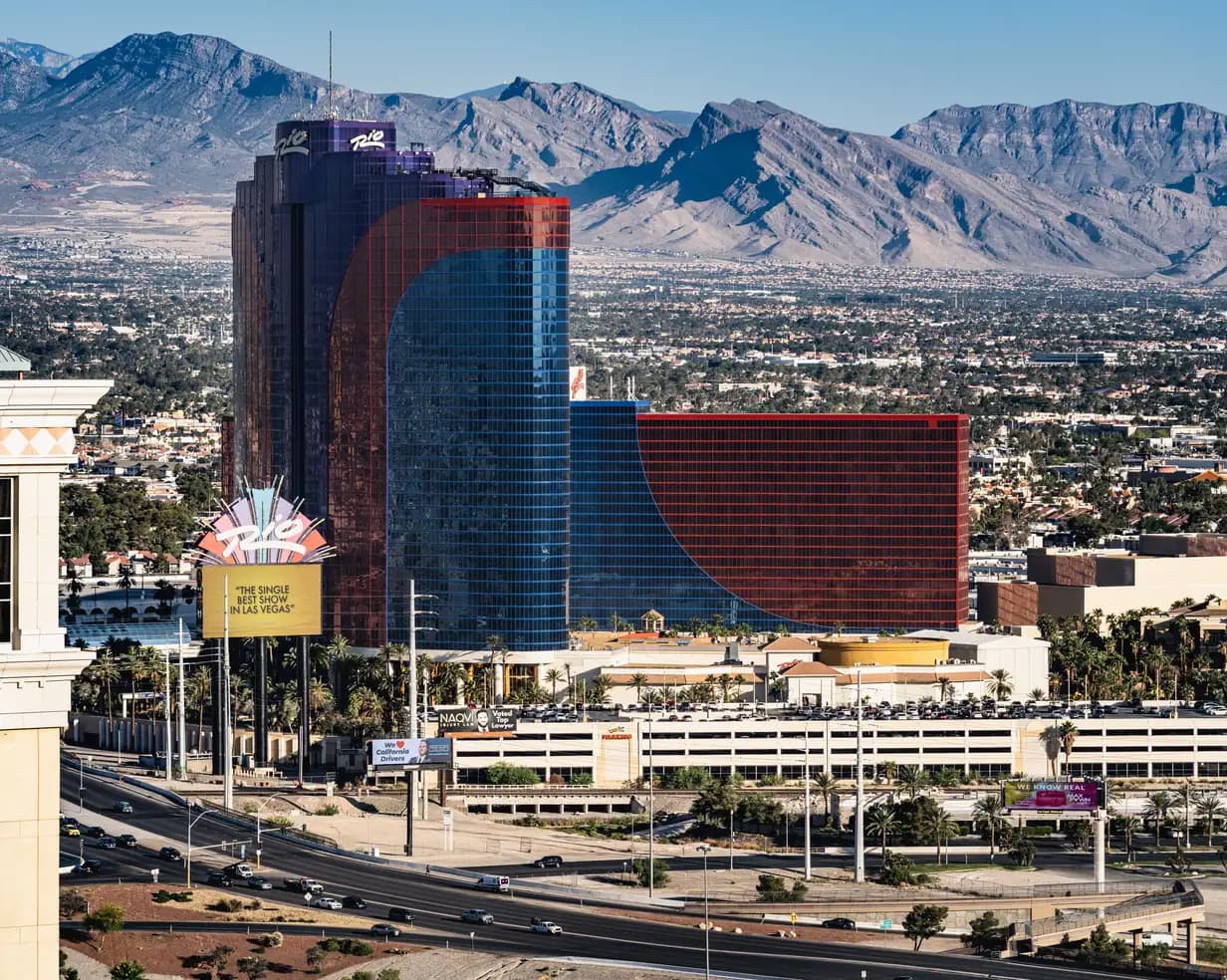 Rio hotel towers in Las Vegas, Nevada, with the Spring Mountains rising behind the city