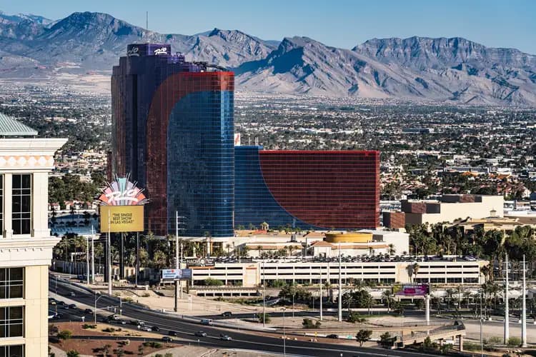 Rio hotel towers in Las Vegas, Nevada, with the Spring Mountains rising behind the city