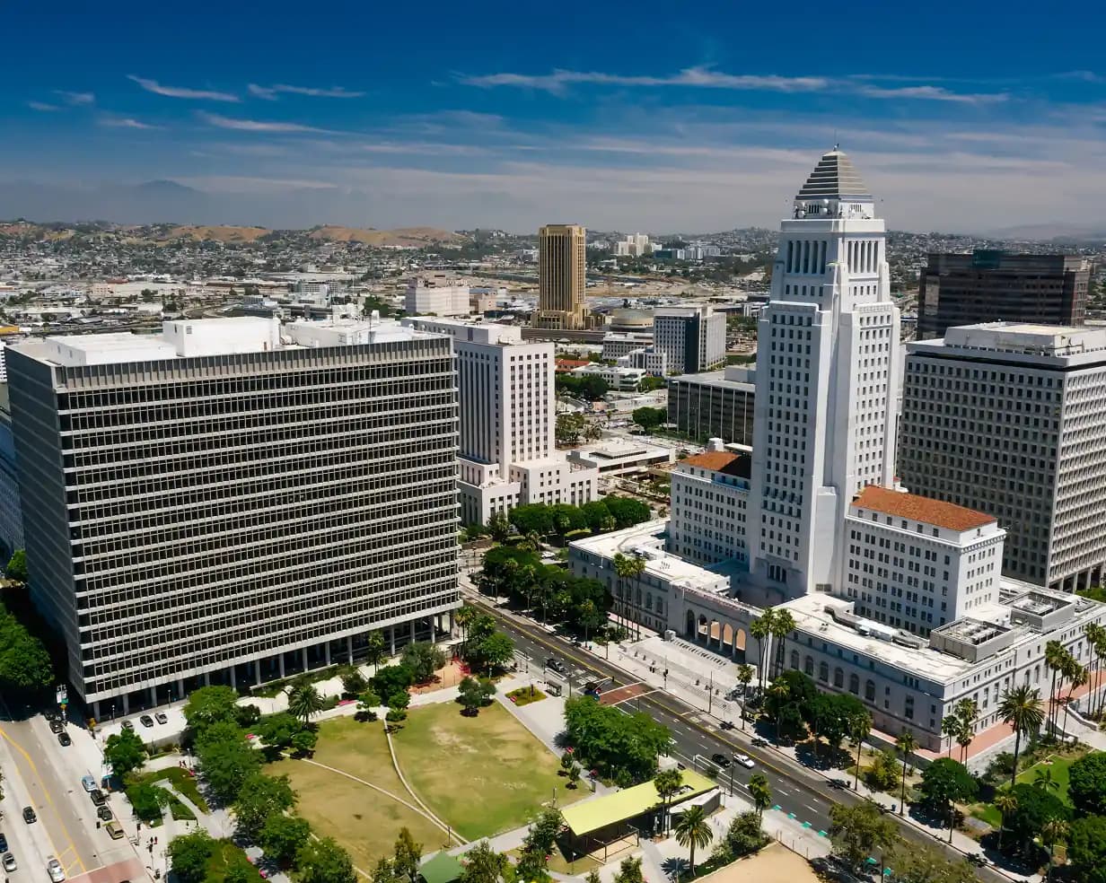 Aerial view of downtown Los Angeles with the LA City Hall tower and surrounding high-rises