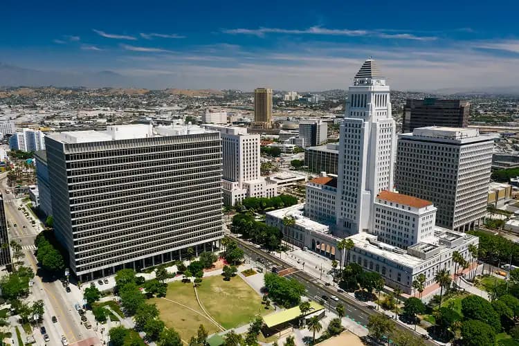 Aerial view of downtown Los Angeles with the LA City Hall tower and surrounding high-rises