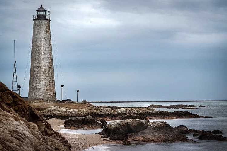 Five Mile Point Lighthouse on the rocky New Haven, Connecticut shoreline, a day-trip stop for charter bus groups