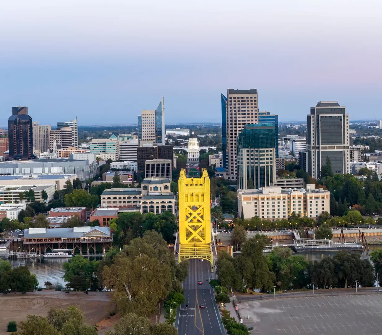 Gold Tower Bridge over the Sacramento River leading to the downtown Sacramento, California skyline and State Capitol