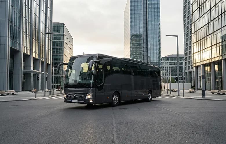 40 passenger black coach bus rental in urban downtown.