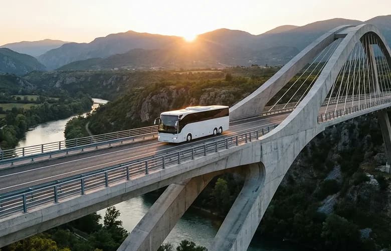 50 passenger white charter bus on scenic bridge.