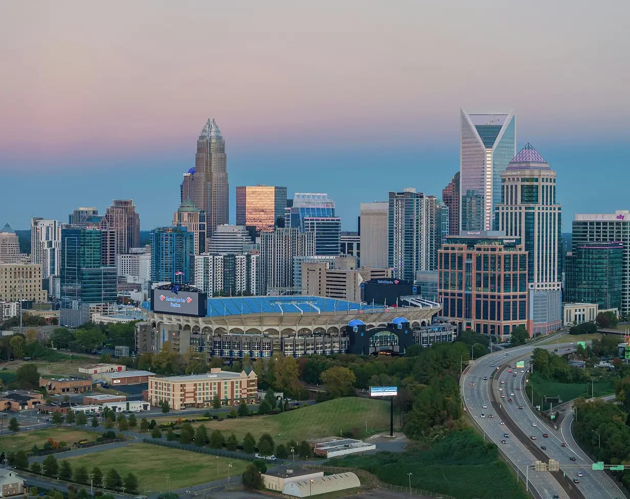 Charter bus rental Charlotte NC skyline.