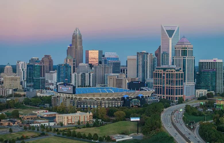Charter bus rental Charlotte NC skyline.