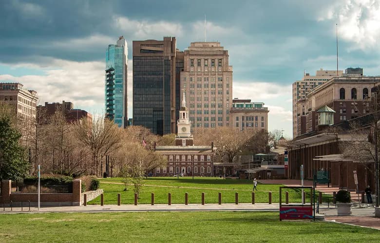 Charter bus rental Philadelphia Independence Hall skyline.