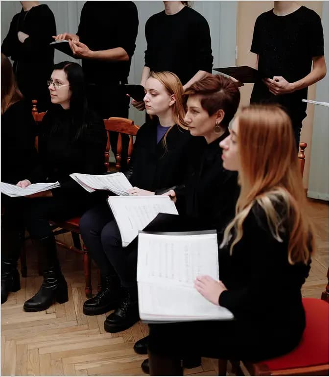 Women in choir rehearsal.