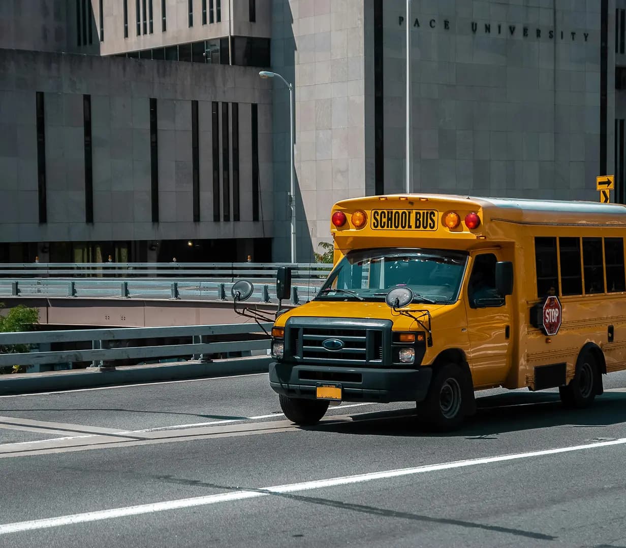 Yellow school bus on road.