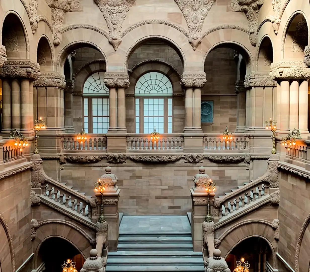 Ornate arches of the Million Dollar Staircase inside the New York State Capitol in Albany, New York, on the lobby-day route for charter bus delegations