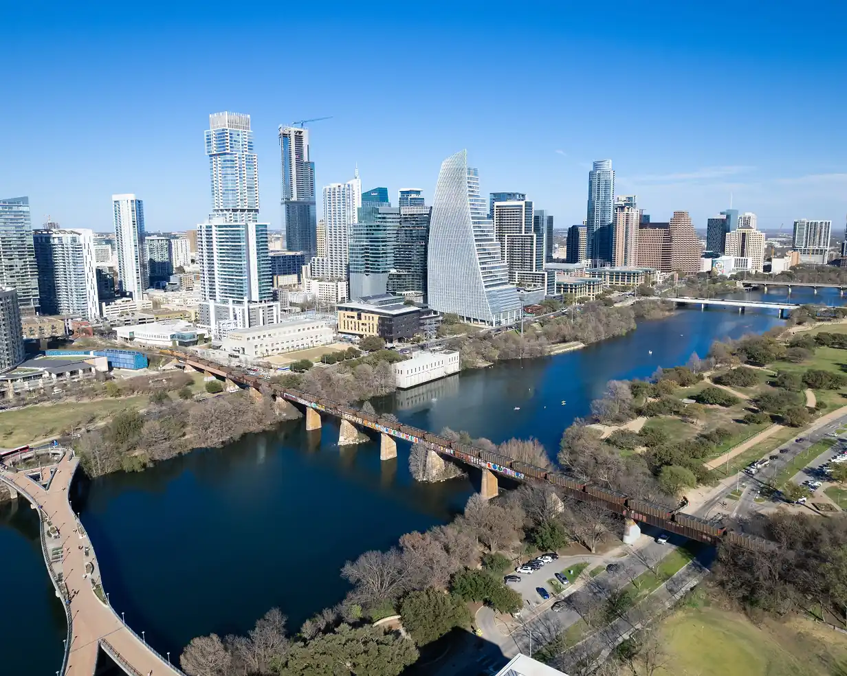 Aerial view of the Austin, Texas skyline and the bridges over Lady Bird Lake, the routes charter bus groups ride downtown