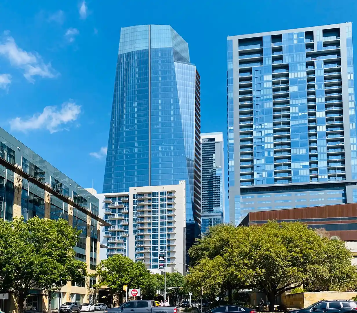 Glass towers of the modern downtown Austin, Texas skyline, a common pickup area for charter bus groups