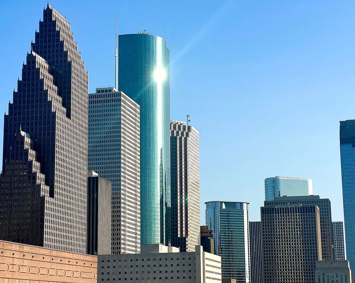 Sun reflecting off the glass skyscrapers of downtown Houston, Texas, a common pickup area for charter bus groups