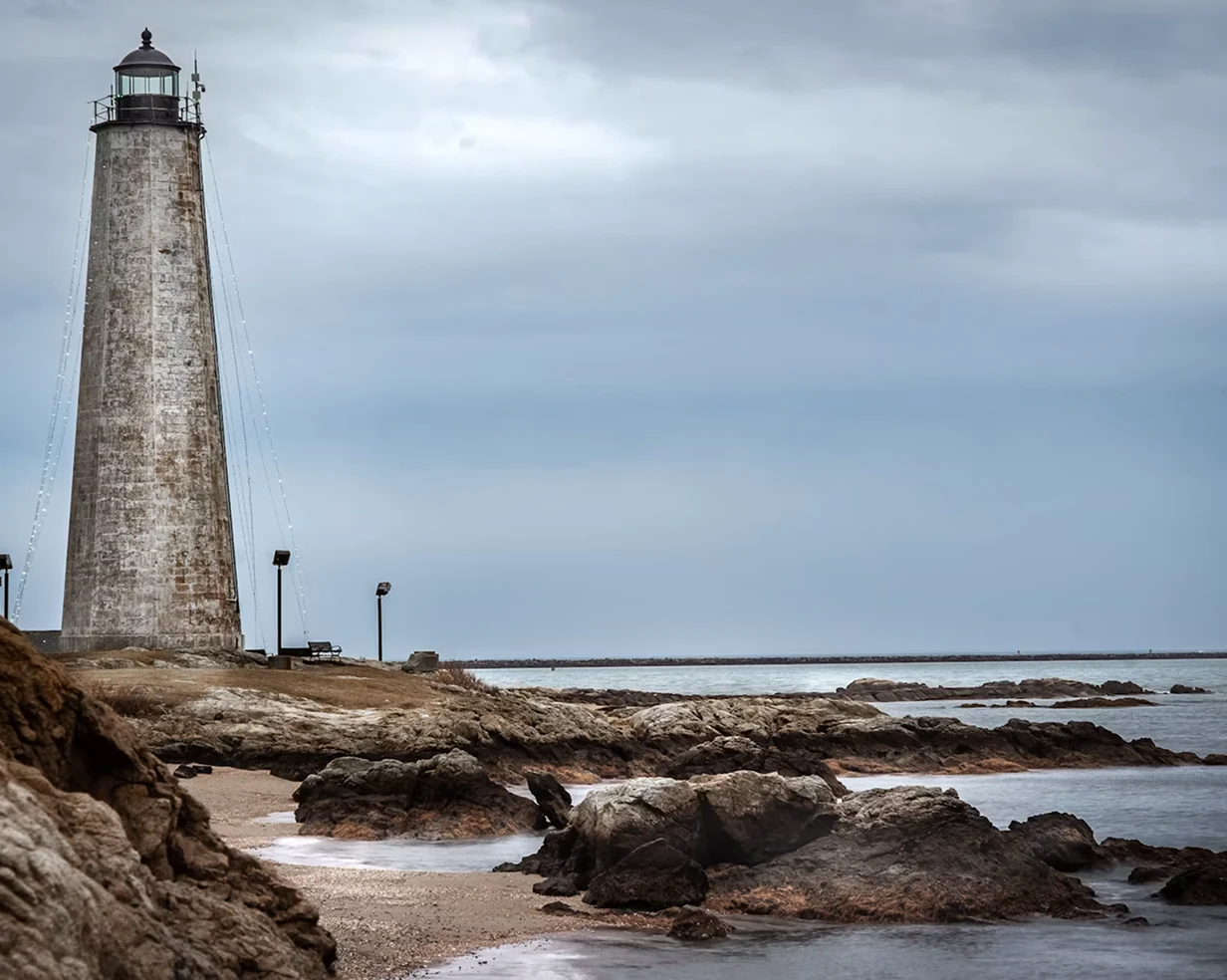 Five Mile Point Lighthouse on the rocky New Haven, Connecticut shoreline, a day-trip stop for charter bus groups