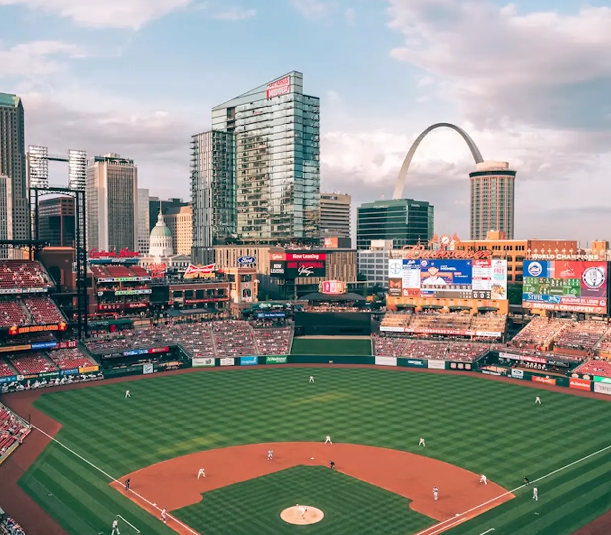 Busch Stadium with the Gateway Arch on the St. Louis skyline, a game-day destination for charter bus groups
