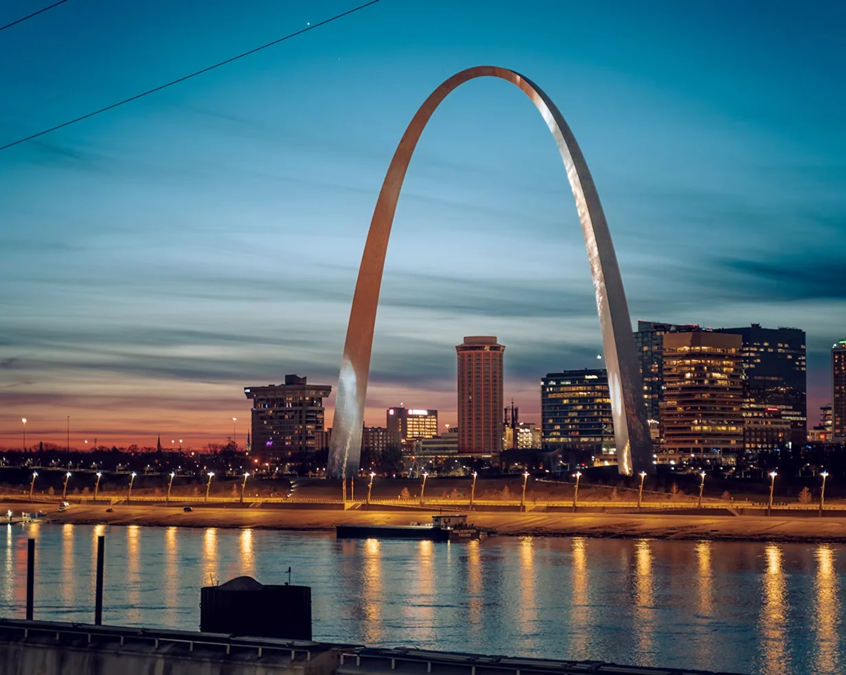 Gateway Arch above the Mississippi River at twilight in St. Louis, Missouri, a common pickup area for charter bus groups
