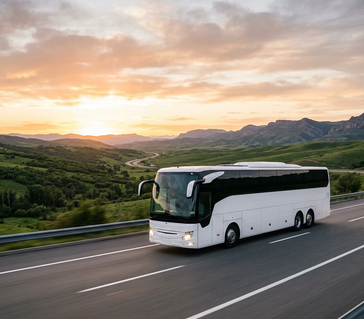 Coach on highway at sunset.