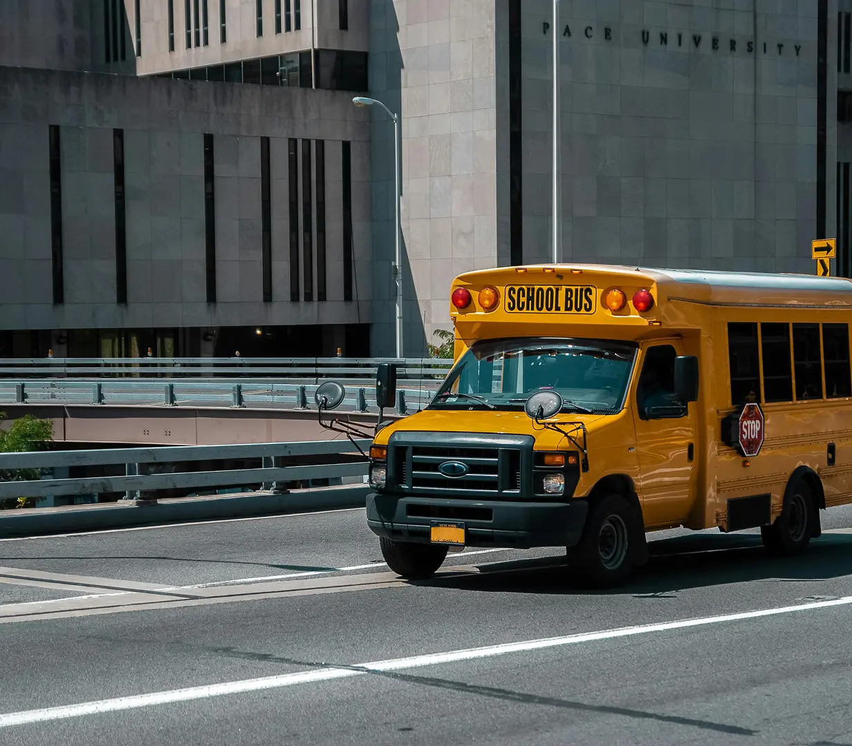 Yellow school bus on road.
